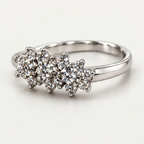 The Triad — Three-Cluster Flower Moissanite Ring on a Slim Band